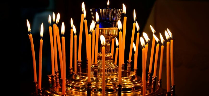 божі привітання з днем народження — A captivating display of lit candles on a golden holder, creating a warm and festive ambiance. | ITmaxService